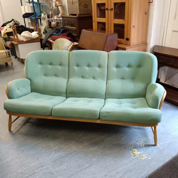 Teal Ercol three-seater sofa in vintage condition.