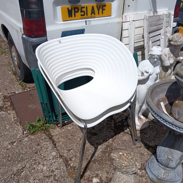 Pair of white Vitra designer chairs with chrome legs.