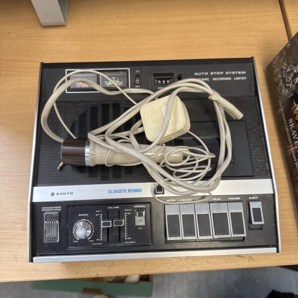 Vintage Sanyo LL cassette recorder with microphone and power cable.