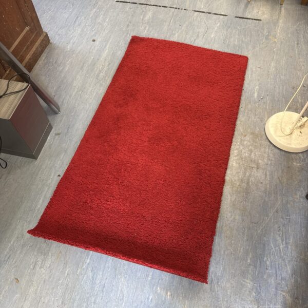 Red IKEA Adum shag rug, approximately 5ft in length.