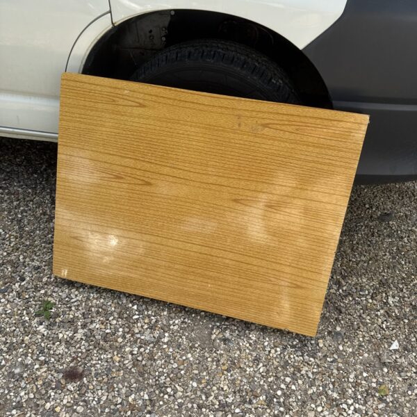 Side view of a heavy-duty folding wooden table.