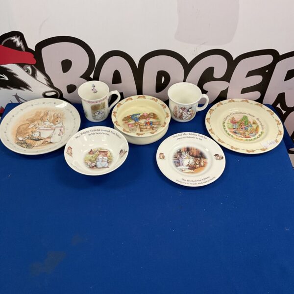 Royal Doulton Beatrix Potter figures and Bunnykins in a collectible lot.