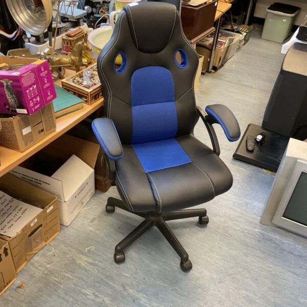 Black and blue Playhaha gaming chair with padded armrests.