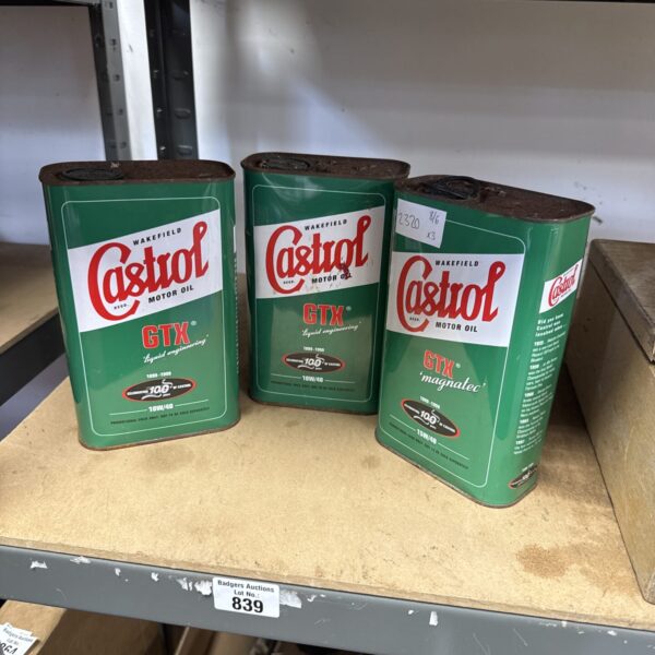 Three vintage Castrol GTX 10W/40 oil cans with classic branding.