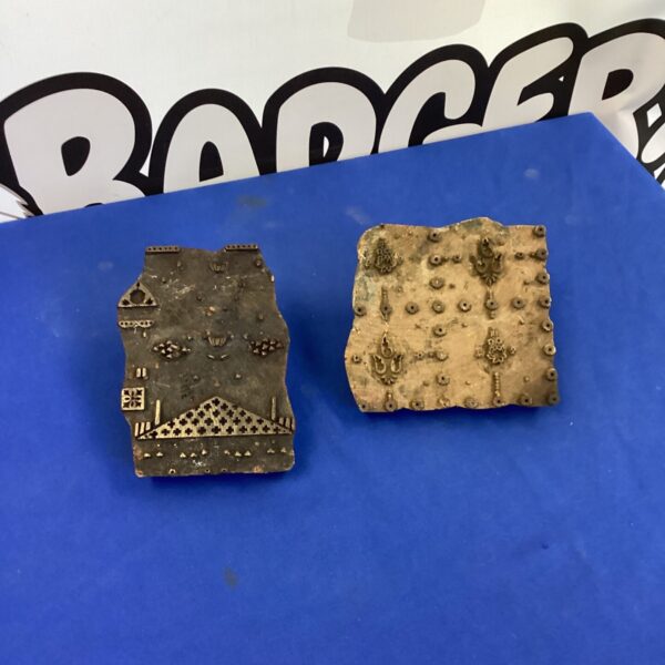 Vintage Japanese woodblock printing blocks with floral designs.