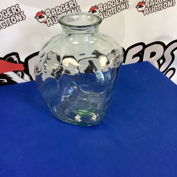 Large vintage glass bottle for display and collection.