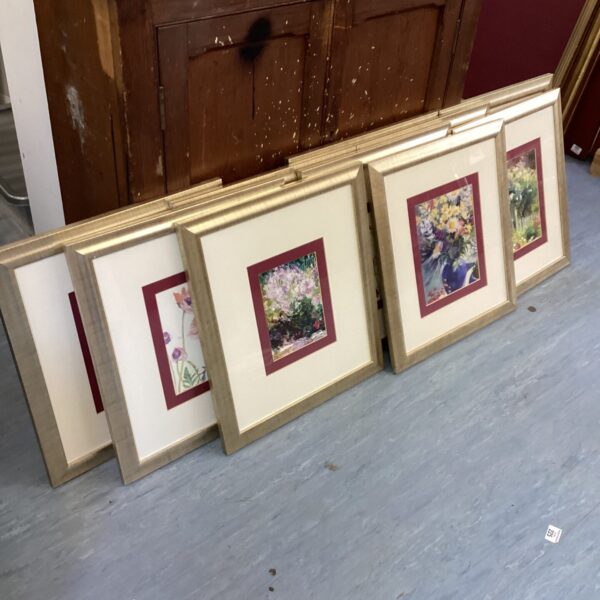 Lot of nine framed flower pictures for wall decor.