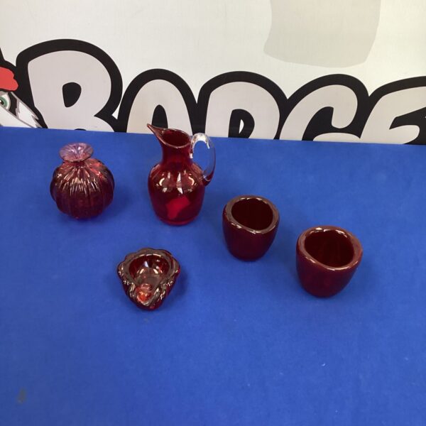 Vintage ruby glass jug, a vibrant red collectible.