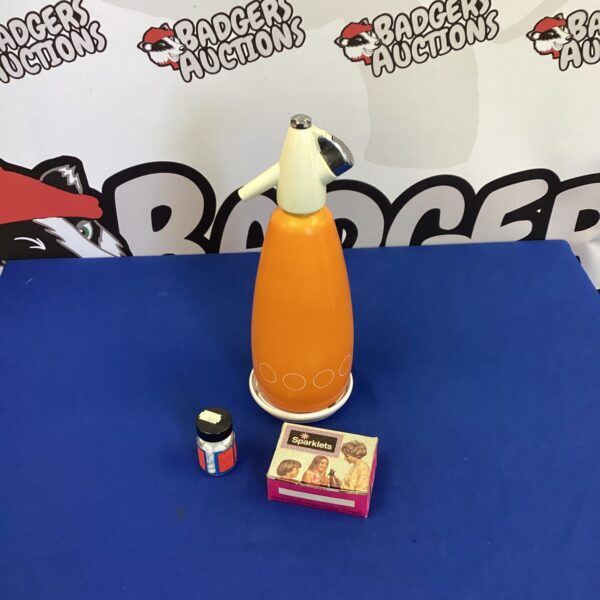 Vintage BOC soda syphon with orange body and chrome lever.