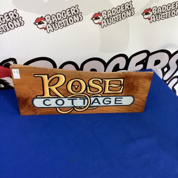 Vintage wooden Rose Cottage sign for garden or home decor.