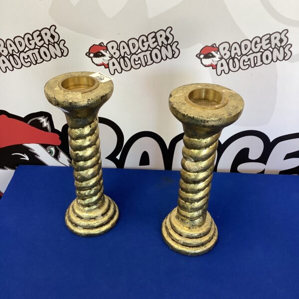 Pair of vintage metal decorative candle holders with twisted design.
