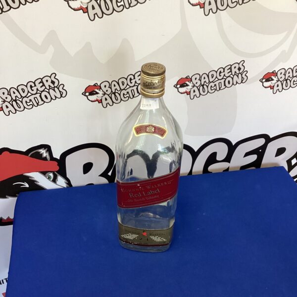 Large Johnny Walker whiskey bottle for collectors and display.