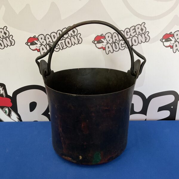 Antique copper bucket with handle, vintage farmhouse decor.