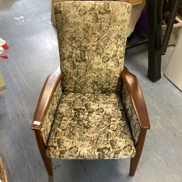 Vintage Parker Knoll armchair with patterned fabric upholstery.