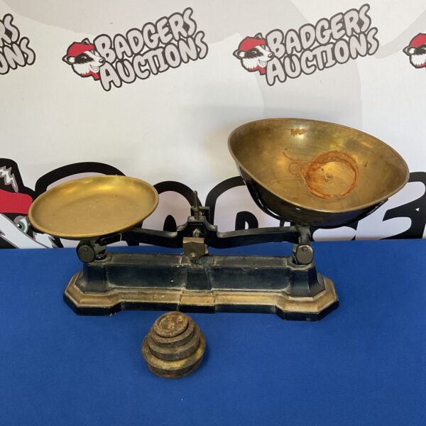 Vintage brass scales with weights for accurate measurement.
