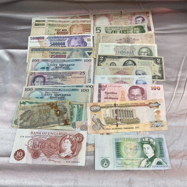 Assorted banknotes from around the world, a collectible currency lot.