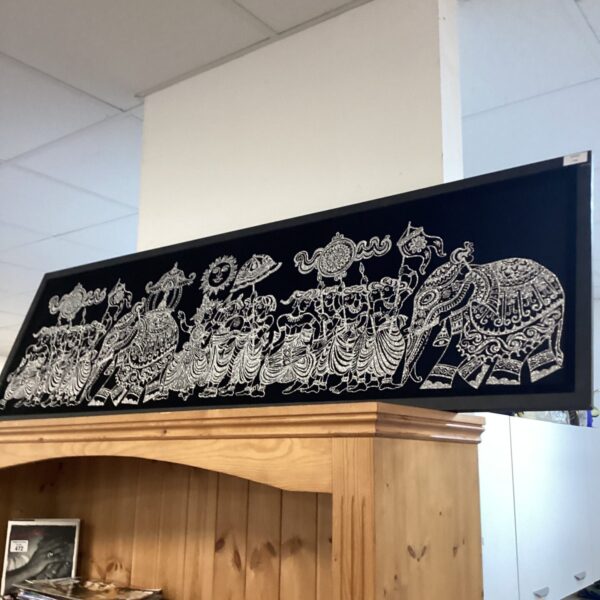 Detailed vintage print of Indian royal procession on black velour.