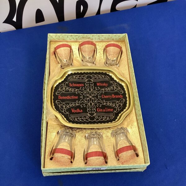 Vintage cordial set with amber glasses on a tray.