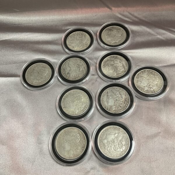 Replica Morgan Dollar coin collection in protective capsules.