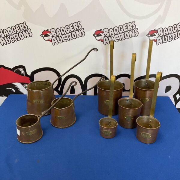 Set of vintage copper cider and litre measures for sale.