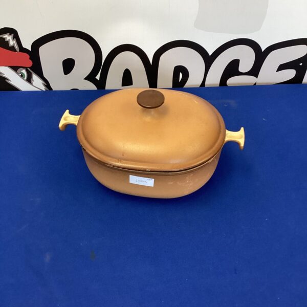 Vintage Le Creuset casserole pot in vibrant colour.