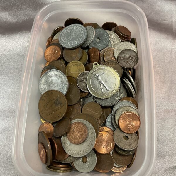 Close-up of an assorted coin lot with mixed currencies.