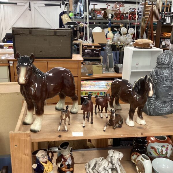 Vintage Beswick porcelain horse figurines in a collection.