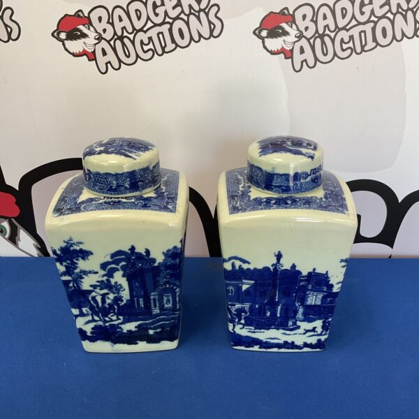 Vintage pair of Ringtons tea containers in blue and white pottery.