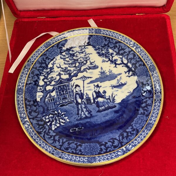 Antique Chinese blue and white porcelain plate with landscape scene.