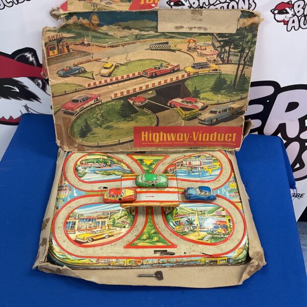 Vintage Highway-Viaduct tin wind-up car track set, colourful toy.