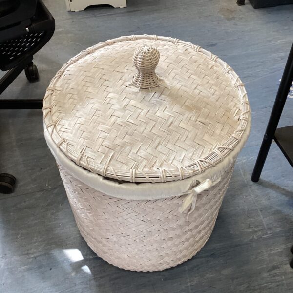 Tall vintage wicker wash basket with lid.