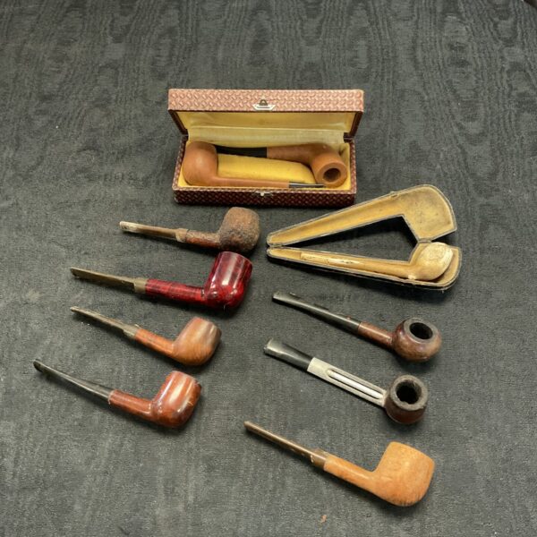 Vintage smoking pipes in a collection, antique briar pipes.