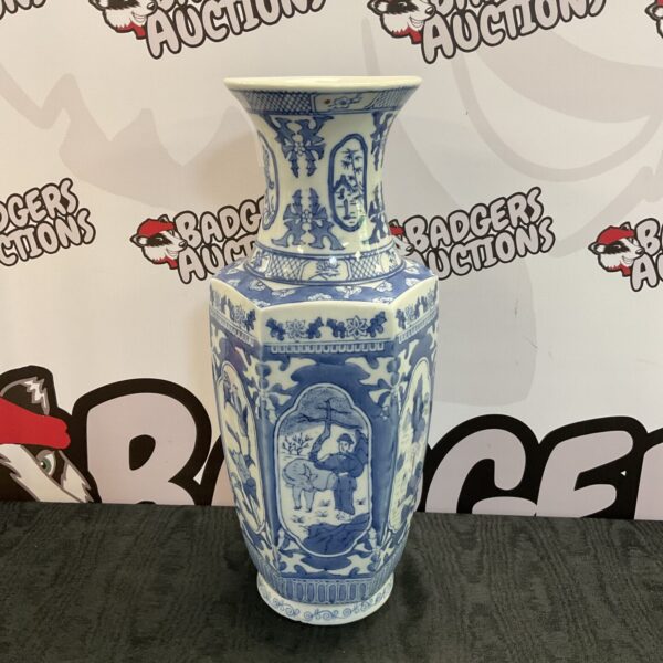 Antique Chinese blue and white porcelain vase with detailed artwork.