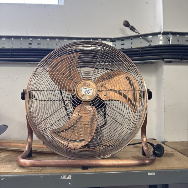 Vintage metal floor fan with a retro aesthetic.