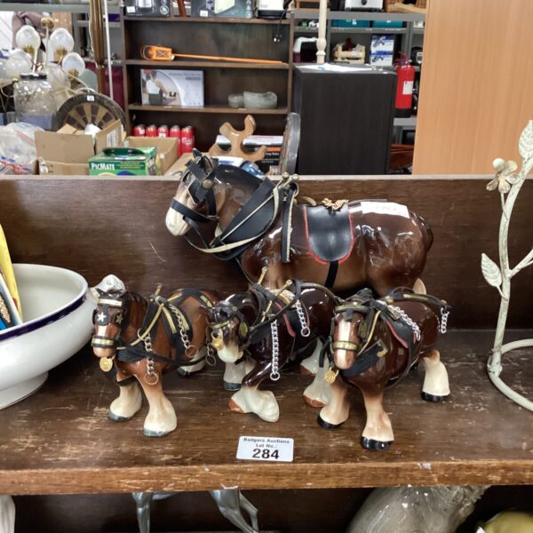 Vintage porcelain horses, including Beswick figurines, in a collectible lot.