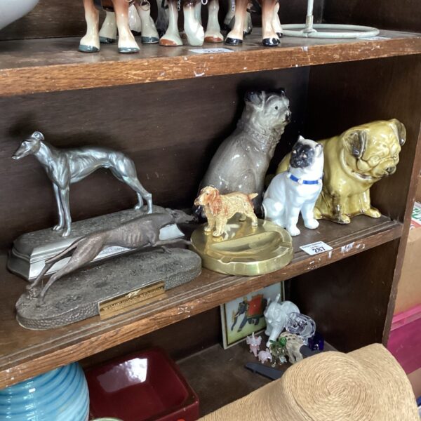 Vintage collection of ceramic dog ornaments and figurines.