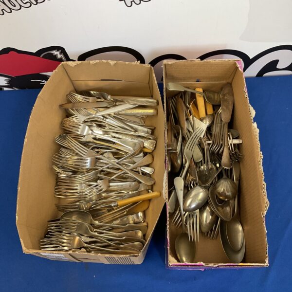 Assorted vintage silver plate cutlery in two boxes.