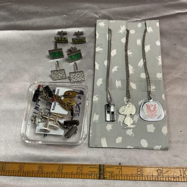 Vintage cufflink and chain lot with silver-tone accessories.