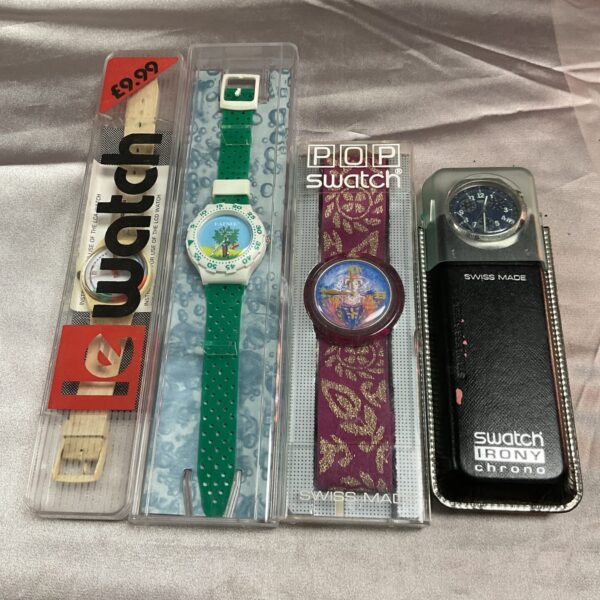 Colourful 1990s Swatch watch with patterned strap.