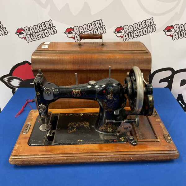 Vintage WCS Federation sewing machine with ornate detailing.