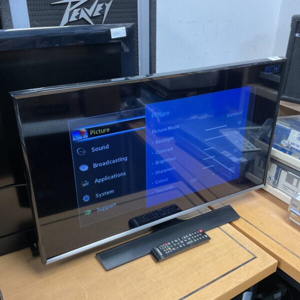 Samsung 32 inch LCD TV with remote control for home entertainment.