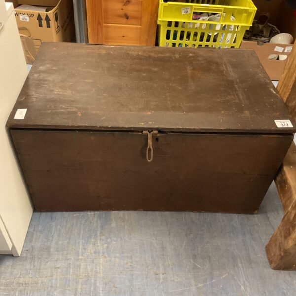 Front view of an antique wooden storage box with rope handle.