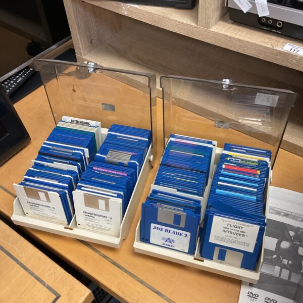 Large lot of vintage Atari ST floppy discs for retro gaming.