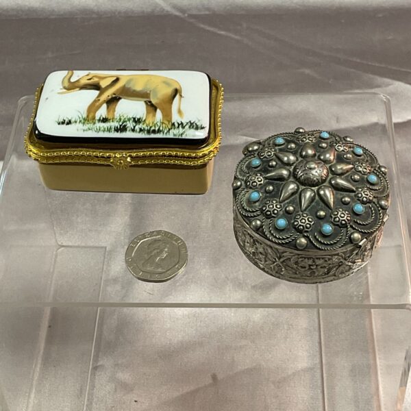 Antique silver trinket pot with enamel floral design.