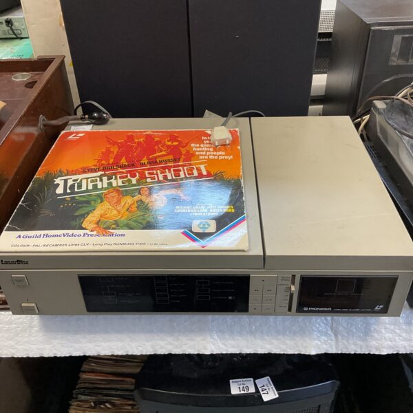 Vintage Pioneer LD-1100 laserdisc player with Turkey Shoot disc.