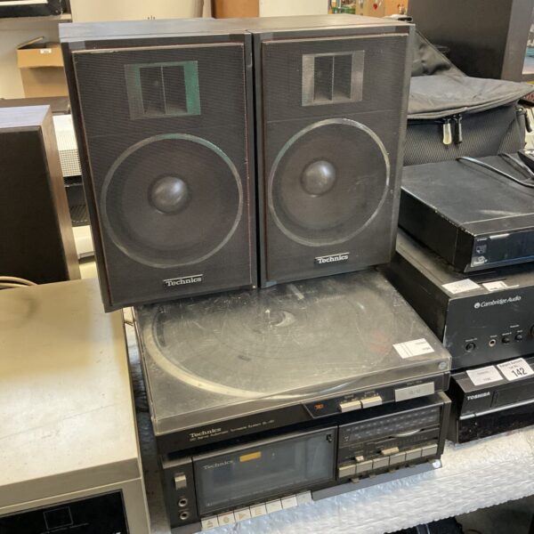 Vintage Technics SL-JS1 stereo system with cassette deck and speakers.