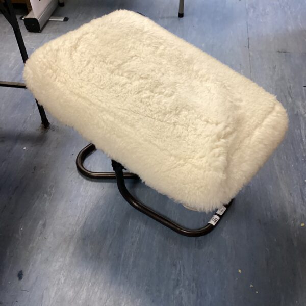 Vintage spring loaded footstool with cream upholstery and chrome legs.