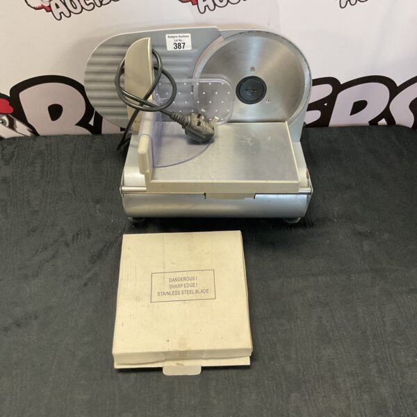 Stainless steel Andrew James meat slicer for kitchen food preparation.