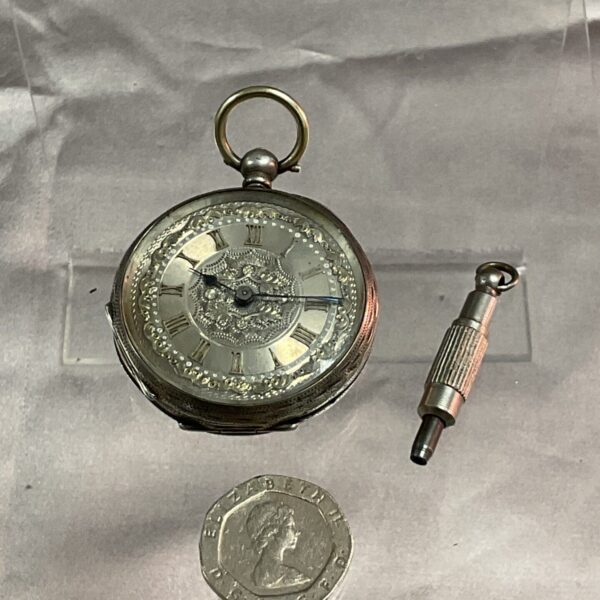 Antique 800 silver ladies pocket watch with floral engraving.