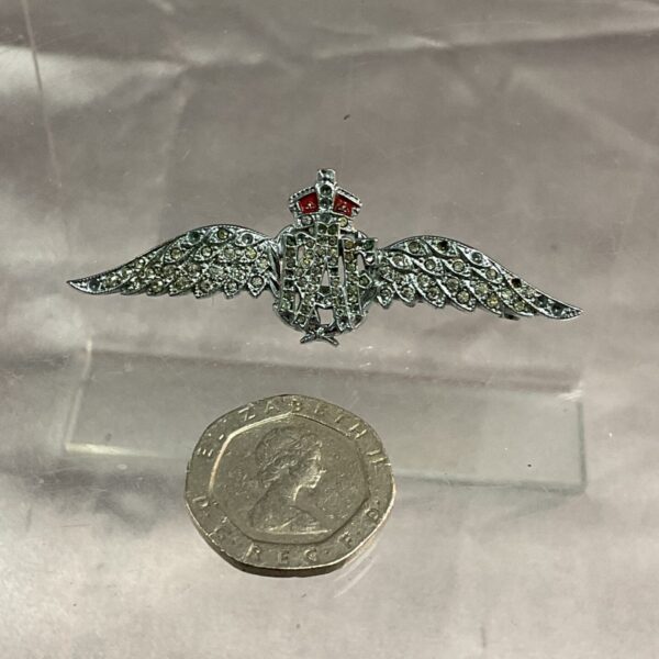 Vintage WWII RAF sweetheart brooch with red cabochon detail.